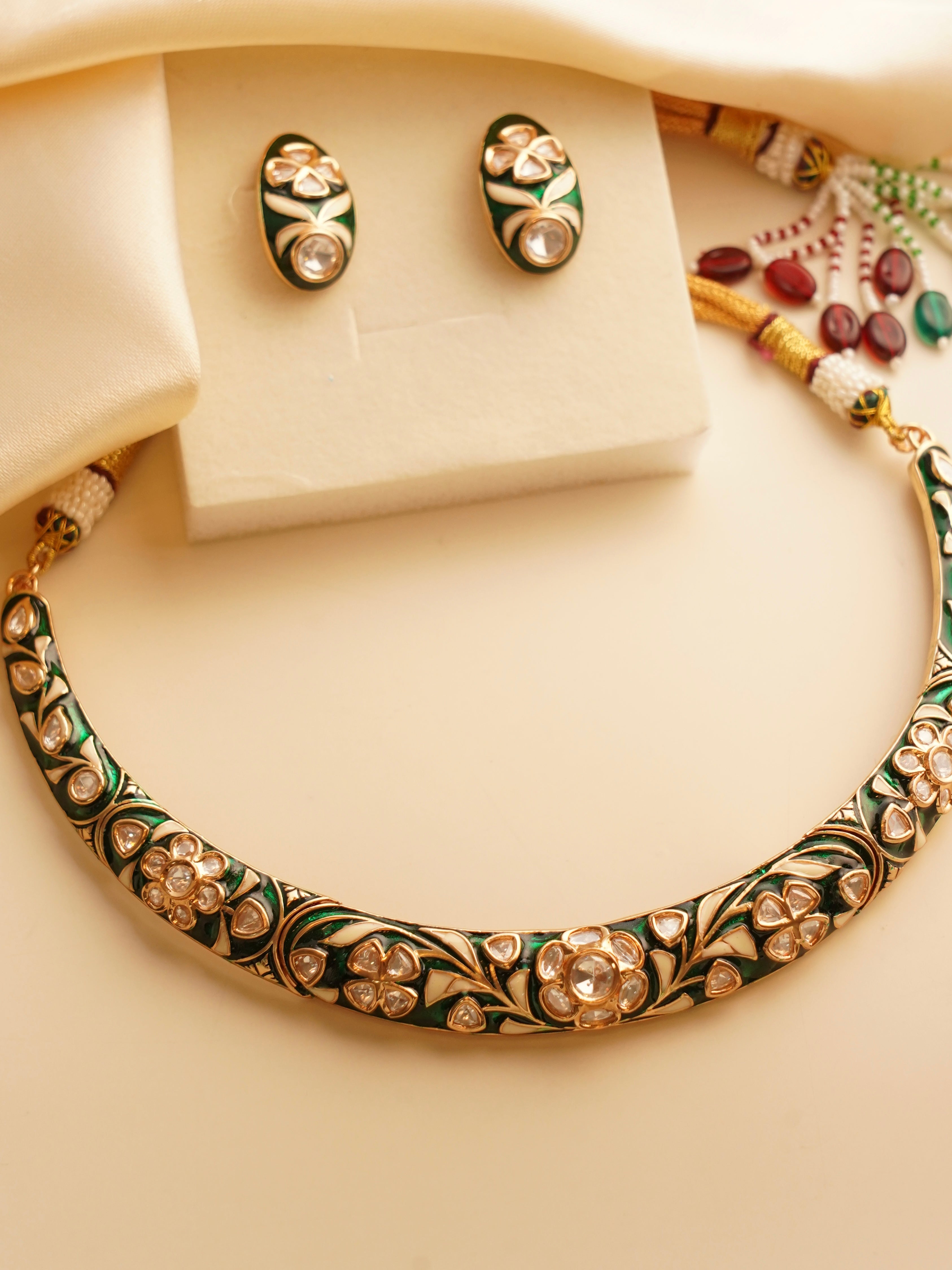 Front view of vibrant meenakari hasli showcasing detailed craftsmanship